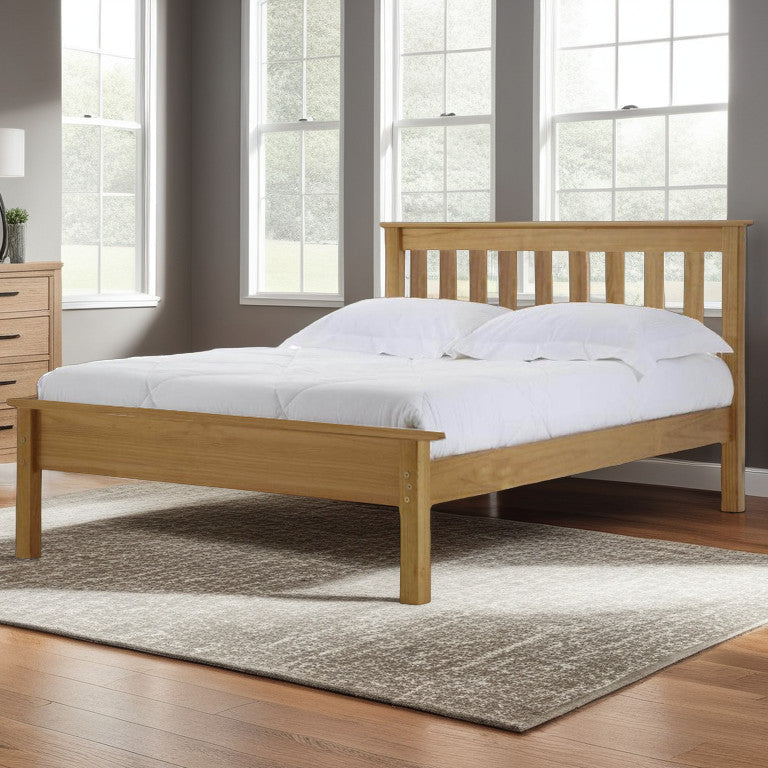 A wooden bed frame with a white mattress on it, placed in a room with wooden flooring and a dresser with a mirror above it. The bed frame has a natural wood finish and the room has two windows allowing natural light to enter.