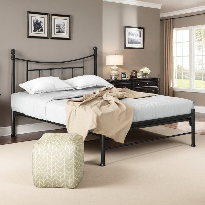 A metal bed frame with a sleek design, featured in a bedroom setting with bedding and side tables.
