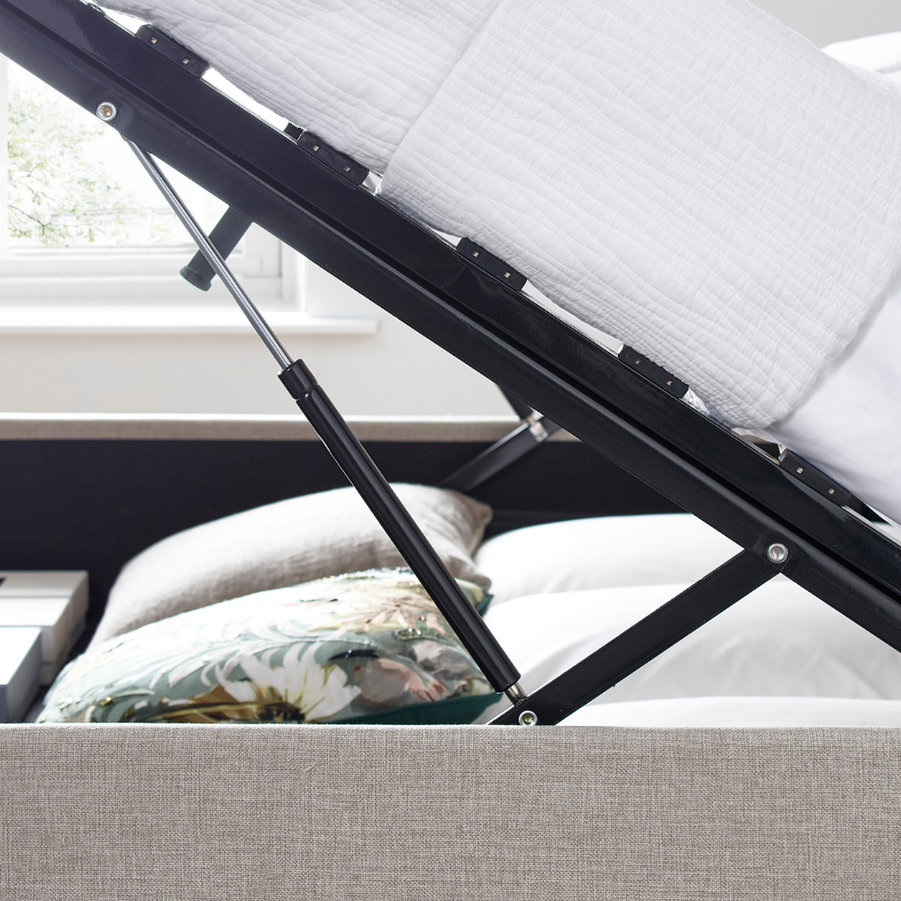 Close-up of a bed with a mattress and headboard, showing the support system.