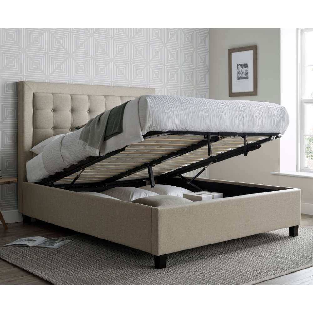 Beige upholstered open ottoman bed.