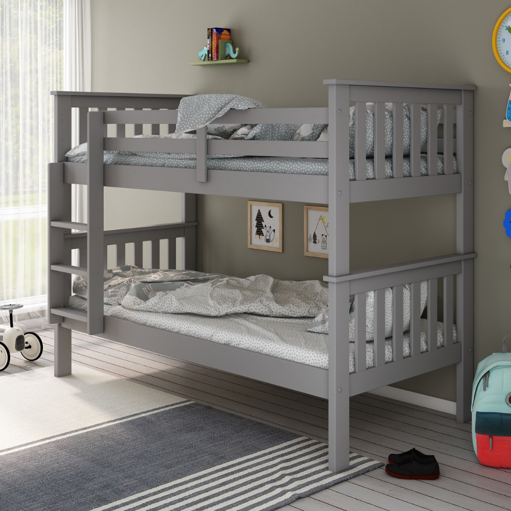 Grey bunk bed in a room with toys and decor on the floor.