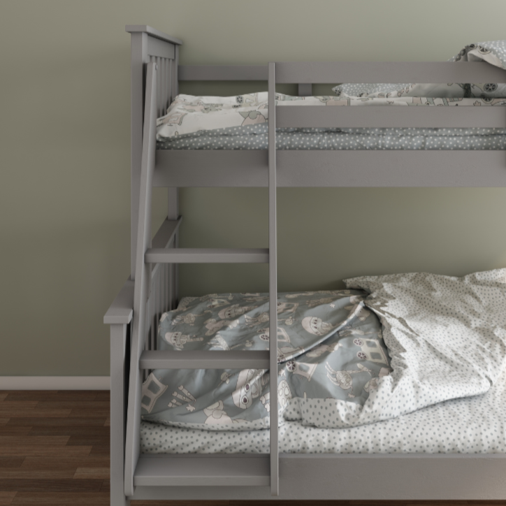 Grey bunk bed with patterned bedding against a plain wall.