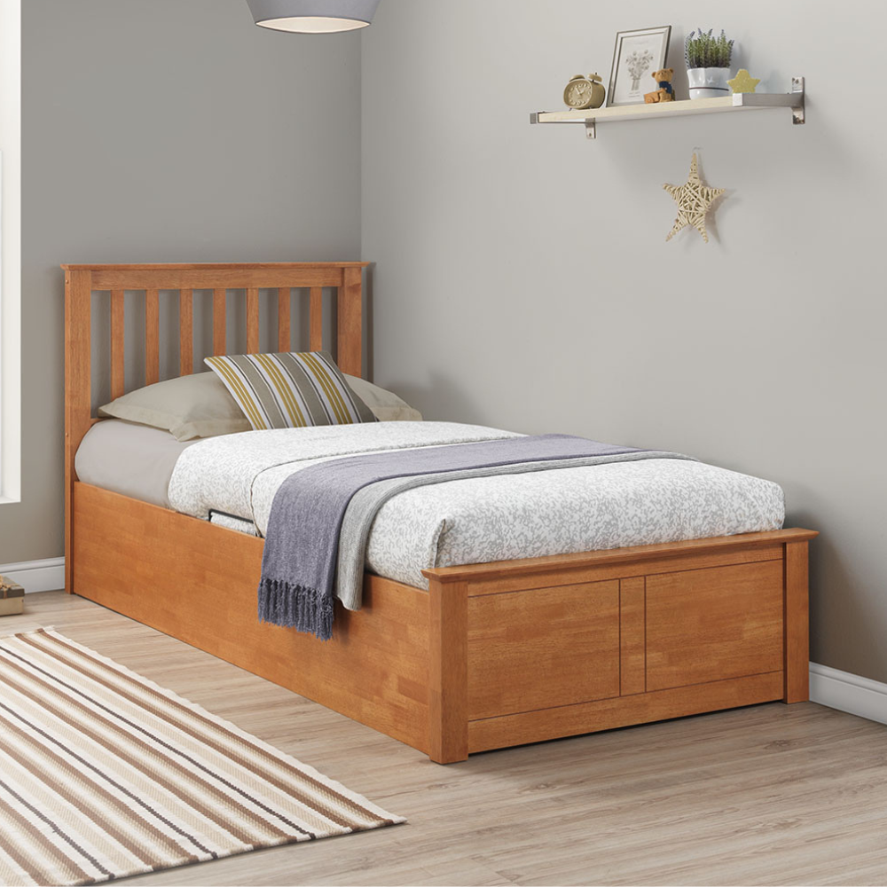 Wooden bed with bedding in a room setting