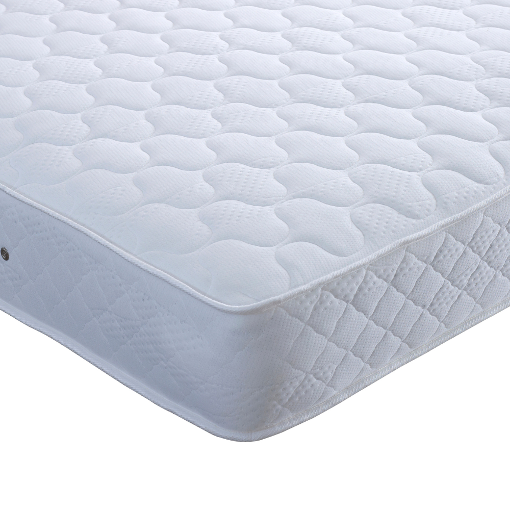 White quilted mattress on a white background
