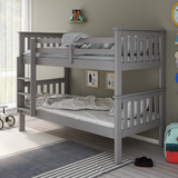 Grey bunk bed in a room with toys and decor on the floor.