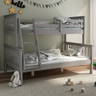 A grey bunk bed in a childs bedroom with a green painted wall. 