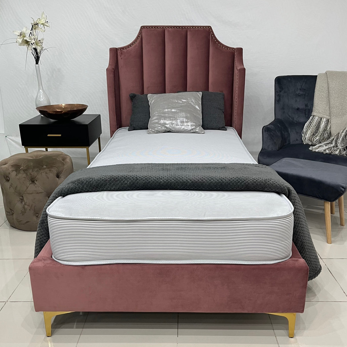 A dorchester contract mattress on a bed. 