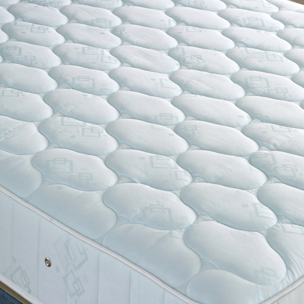 Close-up of a mattress with a wavy pattern