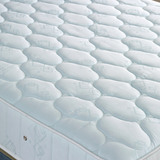 Close-up of a mattress with a wavy pattern