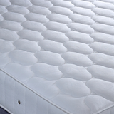 Close-up of a quilted mattress.