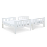 Two white wooden bed frames on a white background