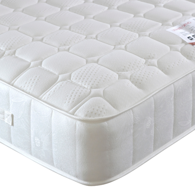 White mattress with a textured surface on a white background